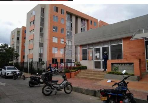 a group of motorcycles parked in front of a building at 2 Habitaciones 2Aires Reservas SL in Cúcuta