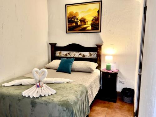 Ένα ή περισσότερα κρεβάτια σε δωμάτιο στο Hotel Casa Jasmin