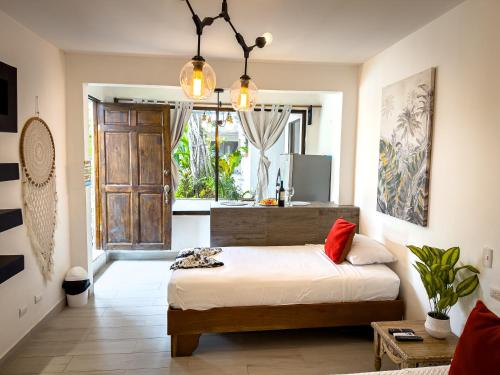 Postel nebo postele na pokoji v ubytování Emma Hotel Jaco