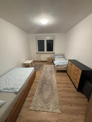 En eller flere senge i et værelse på Speedstay oberhausen