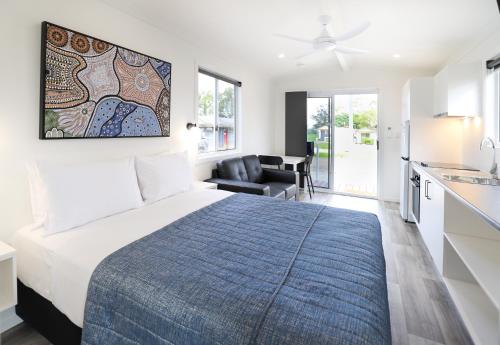 Ένα ή περισσότερα κρεβάτια σε δωμάτιο στο Kingaroy Holiday Park