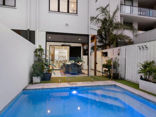 a swimming pool in the backyard of a house at 3 Bed Coastal Escape, Pool, 1 Minute walk to Beach in Kingscliff