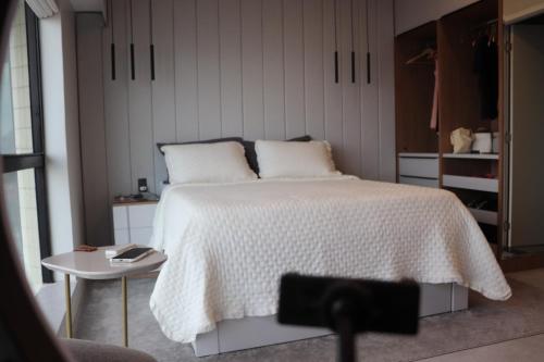 Ένα ή περισσότερα κρεβάτια σε δωμάτιο στο Aconchego Amazônico no Tropical Executive