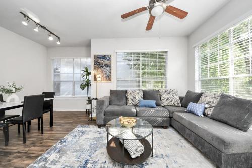 a living room with a couch and a table at Cozy 3-Bd Haven Close to Med Center & Downtown HTX in Houston