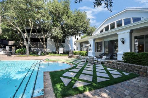 an exterior view of a house with a swimming pool at Cozy 3-Bd Haven Close to Med Center & Downtown HTX in Houston