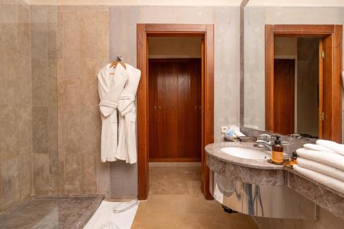 a bathroom with a sink and a mirror at Palais Nouhass in Marrakesh