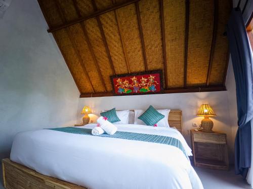 En eller flere senge i et værelse på The Bluhu Hill Cottage