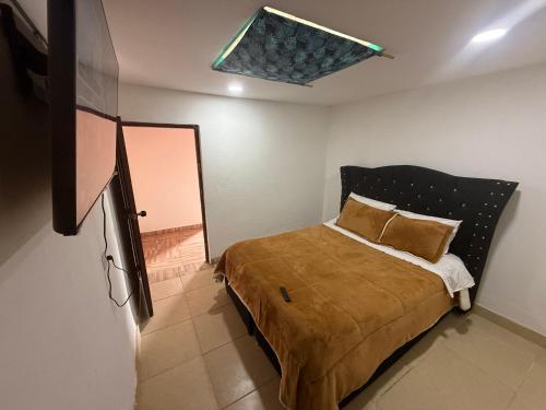 Giường trong phòng chung tại Cabañas Casa Campo Guatavita