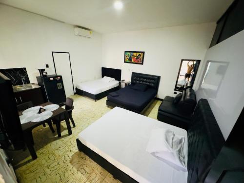 Postel nebo postele na pokoji v ubytování Apartaestudio san Jose