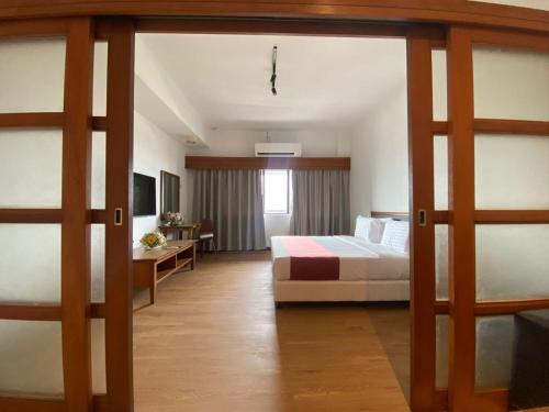 Ένα ή περισσότερα κρεβάτια σε δωμάτιο στο 103 Hotel