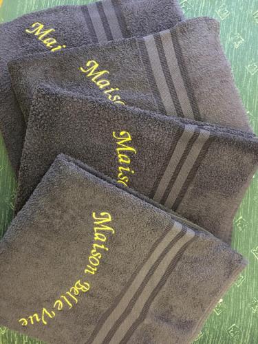 a group of three socks with yellow writing on them at Maison Belle Vue in Chioggia