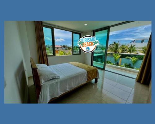 Postel nebo postele na pokoji v ubytování Palmares Beach