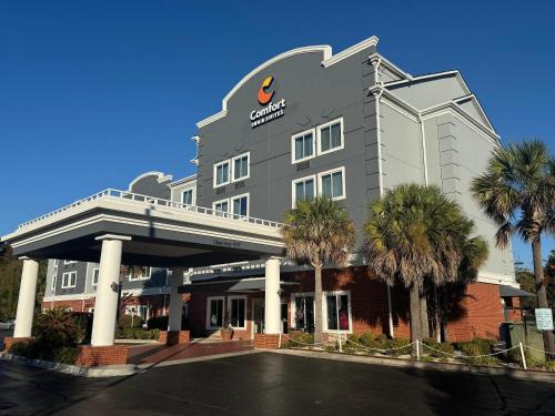 a rendering of a hotel with palm trees in front of it at Comfort Inn & Suites North Charleston - Northwoods in Charleston Heights