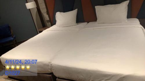 Ein Bett oder Betten in einem Zimmer der Unterkunft Minh Tân Apartment Mandala