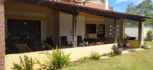 a view of a house with a patio at Pé na Terra - Suítes in São Miguel do Gostoso