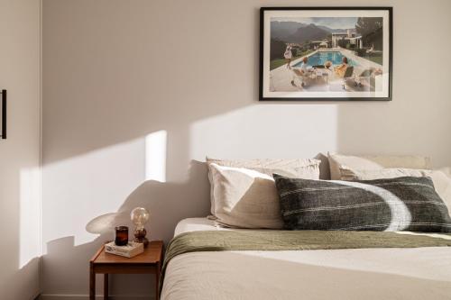 a bedroom with a bed and a swimming pool at Garden oasis in the heart of Fitzroy in Melbourne