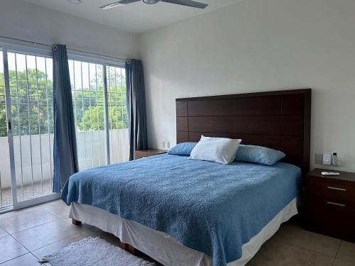 Ένα ή περισσότερα κρεβάτια σε δωμάτιο στο Terraza Carrizalillo