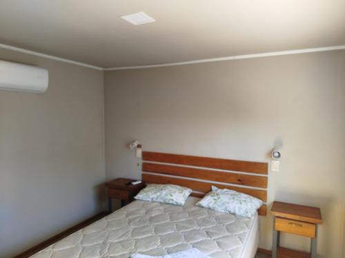 Ένα ή περισσότερα κρεβάτια σε δωμάτιο στο apart centro