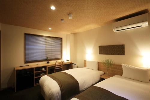 Una cama o camas en una habitación de Excellent Hotel - Vacation STAY 50210v