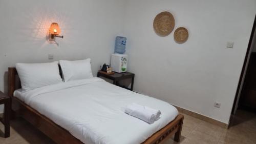 Ένα ή περισσότερα κρεβάτια σε δωμάτιο στο Ulutel Guest House