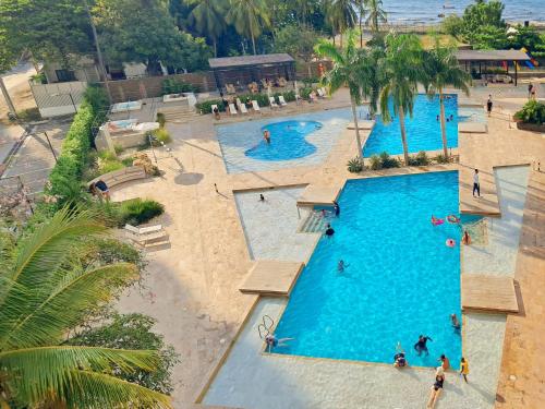 an overhead view of a swimming pool at a resort at Reserva del Mar Resort Club de Playa in Santa Marta