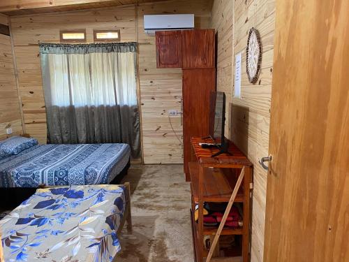 En eller flere senge i et værelse på Cabaña Don floricel