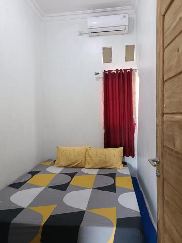 En eller flere senge i et værelse på Alza