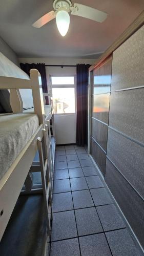 Una cama o camas en una habitación de Apartamento no Residencial Umuarama A