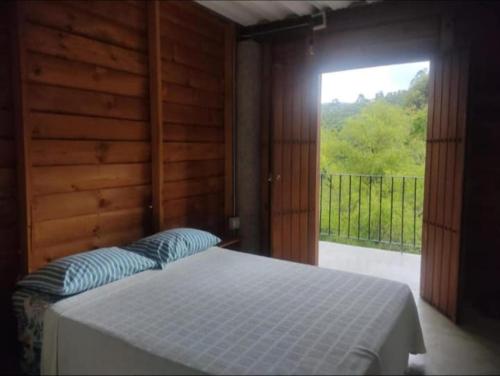 Postel nebo postele na pokoji v ubytování Jardín Utopía