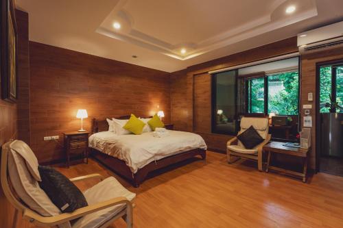 Ένα ή περισσότερα κρεβάτια σε δωμάτιο στο Namtok Sarika Resotel