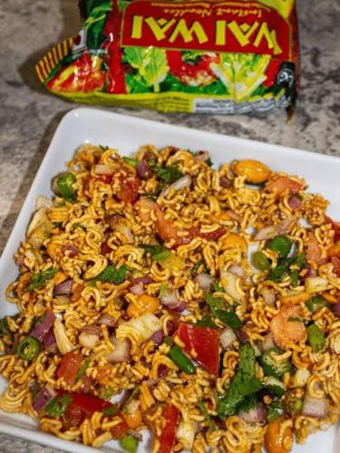 a white plate of food on a table at Umananda Hotel and Lodge in Birtamode