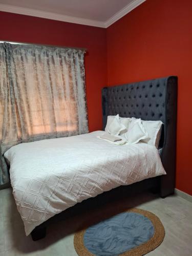 Ένα ή περισσότερα κρεβάτια σε δωμάτιο στο Cosy Cottage Apartments ,Area L