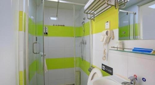 a bathroom with a shower and a sink at 7 Days Inn Chengdu North Railway Metro Station in Chengdu