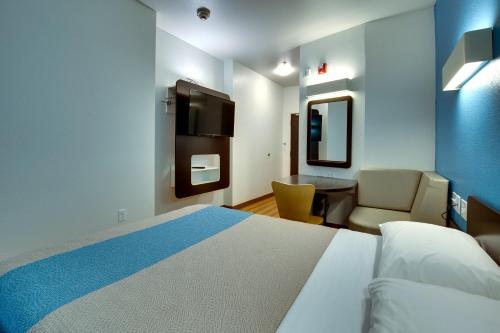 Ένα ή περισσότερα κρεβάτια σε δωμάτιο στο Motel 6 Poplar Bluff, MO