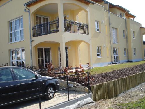 a car parked in front of a house at Apartment Frank - bis zu 3 Schlafzimmer in Rust