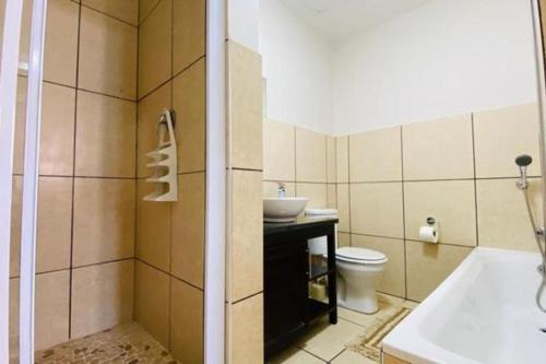 a bathroom with a sink and a toilet at Colonial Sands 8 sleeper with Jacuzzi in Margate