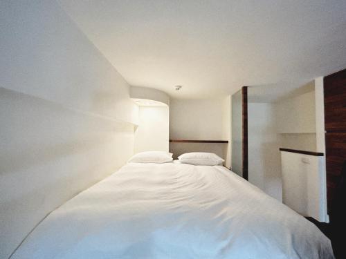 En eller flere senge i et værelse på 森泉湯宿