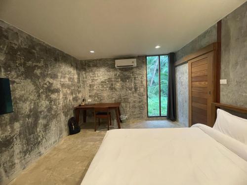 Кровать или кровати в номере COCO Home 2 โคโค่โฮม เฟส 2