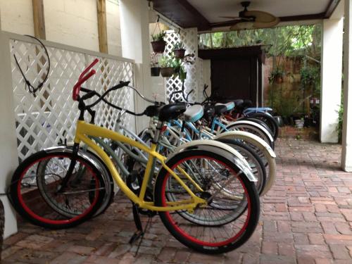 a row of bikes parked next to a building at St. Francis Inn - Saint Augustine in Saint Augustine