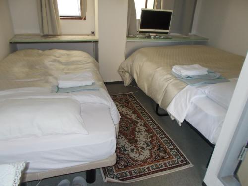 Una cama o camas en una habitación de Hotel Avanti