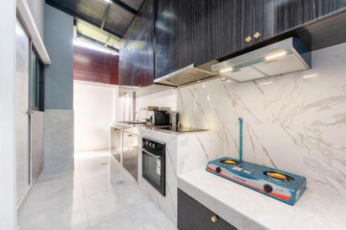 a kitchen with a appliance on a counter at Sorrento Pool Villa Jomtien Beach in Jomtien Beach