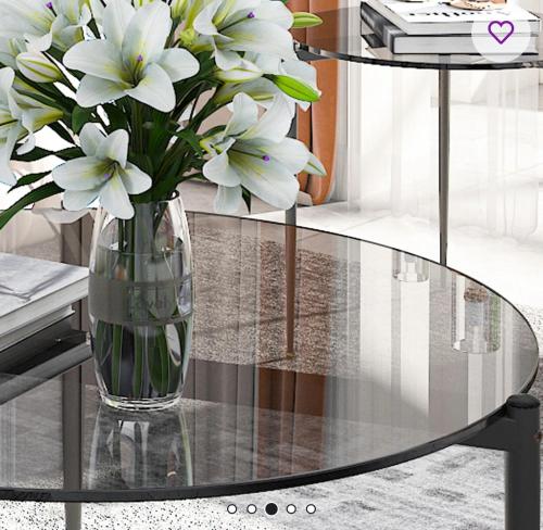 a glass table with a vase of flowers on it at Clarkson Court in Hatfield
