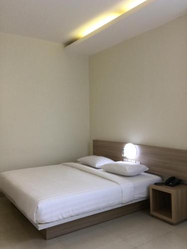 Ένα ή περισσότερα κρεβάτια σε δωμάτιο στο MSquare Palembang