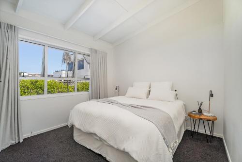 Ένα ή περισσότερα κρεβάτια σε δωμάτιο στο HINE100 - Hinemoa Haven