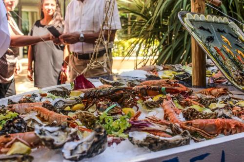 a table full of lobsters and other seafood on display at Hotel Lido in Cattolica