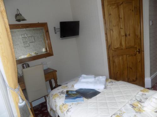 Ένα ή περισσότερα κρεβάτια σε δωμάτιο στο Glendale Guest House