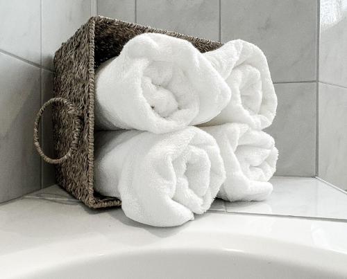 a basket full of towels in a bathroom at Goldberg-Aparts in Rauris