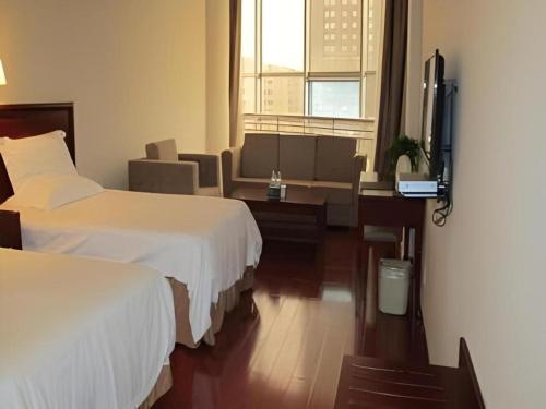 Ένα ή περισσότερα κρεβάτια σε δωμάτιο στο GreenTree Inn Rizhao Yantai Road