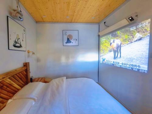 Ένα ή περισσότερα κρεβάτια σε δωμάτιο στο Nostalgia 28 lodge