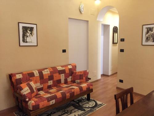 a living room with a couch and a table at Palazzo di Città in Saluzzo